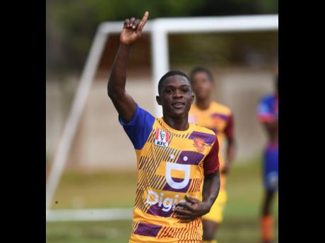 St Andrew Technical High School’s Leon Brown celebrates scoring during their 5-0 win in the Inter-Secondary Schools’ Sports Association football match against Dunoon Technical at STATHS yesterday. 
