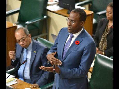 Credit: Kenyon Hemans/Photographer Finance and the Public Service Minister Dr Nigel Clarke delivers details on the First Supplementary Estimates during Tuesday’s sitting of Parliament.