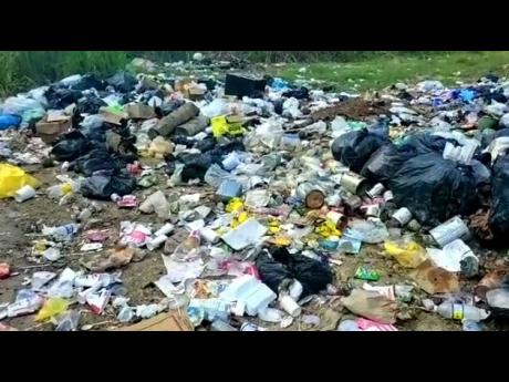Credit: Contributed Garbage is seen piled up on Rickets Street in Savanna-La-Mar, Westmoreland. It is reported that over 150 communities in the parish have a garbage collection backlog.