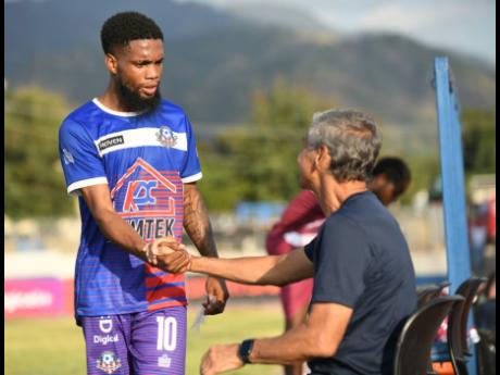 Credit: Gladstone Taylor 
Portmore United’s Lamar Walker (left), pictured here greeting Chapelton Maroons coach Clovis de Oliveira, will be one of the players his coach is depending on to get him some goals.