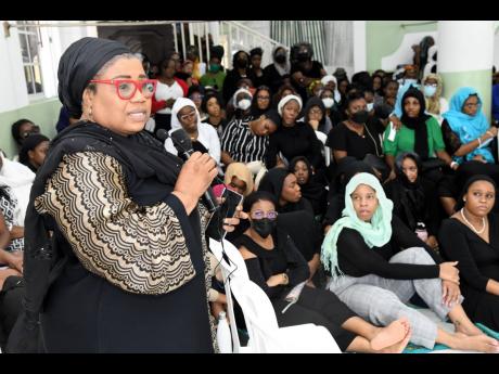 Credit: Rudolph Brown/Photographer Nigerian High Commissioner to Jamaica Dr Maureen Tamuno pays tribute to the late Dr Bilal Abayomi during his janaazah (funeral) prayer at the Central Masjid in Kingston on Tuesday.
