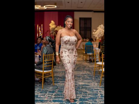 Kayon Mitchell, director, communications, Flow and executive director, Flow Foundation, spoke the language of bombshell fashion in a form-fitting earth-toned sequin gown. 