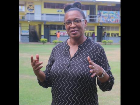 Karen Strachan, year group supervisor for seventh grade talks about Ackalia Dunkley during an interview at Black River High School yesterday. Dunkley is currently receiving treatment for burns sustained during a gas explosion at her home on Friday.