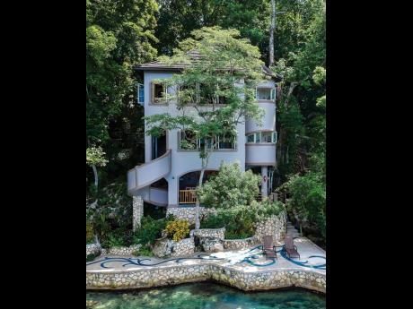 This villa in thick woodland, rising from the sea and anchored to a steep cliff face, is almost impossible to find!