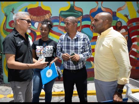 From left: A serious exchange between Jamaican photographer and artist Craig Phang Sang; Andrea Dempster-Chung, chief executive officer, Kingston Creative; Mayor of Kingston Delroy Williams; and Kingston and St Andrew Municipal Corporation Chief Executive 