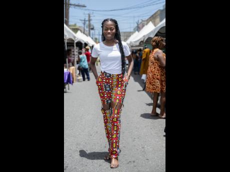 Rocking pants from her own clothing line, Olivia Clue makes her debut on the Art Walk. 