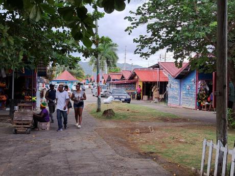 Persons walking through a section of the Harbour Street Craft Market in Montego Bay, St James.