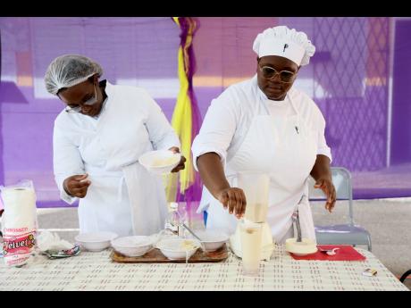 Noelee Petgrave and Camaya Edwards, student xhefs showcase their ‘Breadfruit Punch’ at the Mission:Food Possible training held at Albion Primary School in Manchester  on Saturday. 







