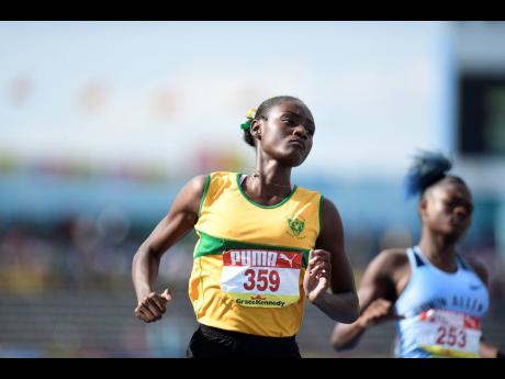 Ackera Nugent (left) competing for Excelsior High in the Class Two 100 metres semi-finals at the 2019 ISSA/GraceKennedy Boys and Girls’ Athletics Championships. 
