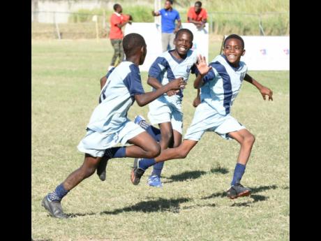 Ian Allen/Photographer
Members of the Balmagie Primary School celebrate after scoring against Spanish Town Primary in the Football Youth League Junior Cup Kingston Regionals under-12 final at University of the West Indies Mona Bowl yesterday.