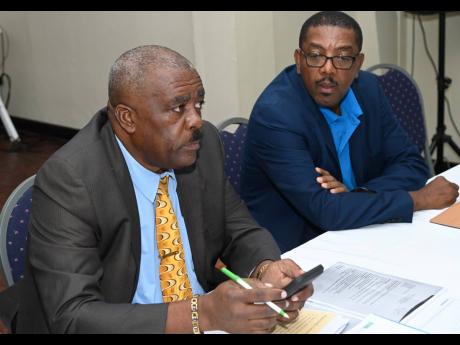 File Photos
Raymond Anderson (left) and Dave Cameron, members of the Real Solid Action slate running in the next Jamaica Football Federation election. 