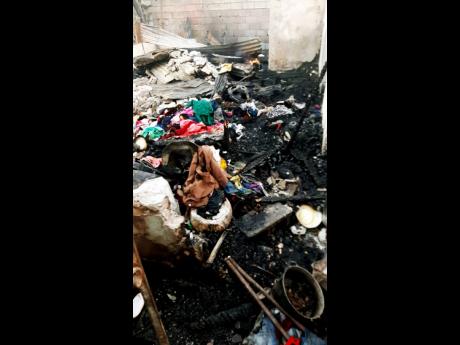 Credit: Andre Williams The charred remains of clothing and other items at premises located at 3 (1/2) and 4 Swettenham Road in Whitfield Town, Kingston 13, which were gutted by fire on Wednesday, leaving 25 people, including children homeless.