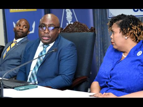 Leighton Johnson (centre), JTA president, with Mark Nicely (left), secretary general of JTA, and JTA's immediate past president, La Sonja Harrison, at the media launch of the JTA’s 60th anniversary celebrations.