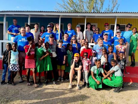 After forming lasting bonds with the Portland Cottage Primary School community during the renovation project over the weekend of February 17-18, donors and volunteers with the Davitt/Ruppert mission group were excited to capture the memories during a group