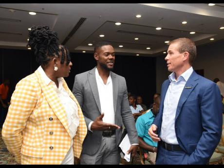 Credit: Ashley Anguin From left: Janet Silvera, chairperson of the Jill Stewart Mobay City Run, in conversation with Richard Vernon, Mayor of Montego Bay, and Adam Stewart, executive chairman of Sandals Resorts International during the event's launch at Holiday Inn Resort in Mo