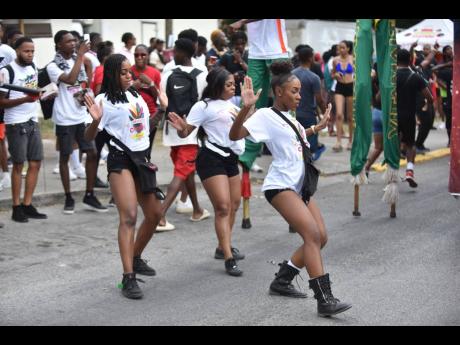 The GenXS dance team brings the vibes for attendees of the UWI carnival who had no choice, but to match their high energy.