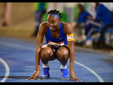 Credit: Gladstone Taylor Hydel High's Alliah Baker celebrates winning gold in the Class One girls' 100 metres at the ISSA/Grace Kennedy Boys and Girls' Championships at the National Stadium tonight.