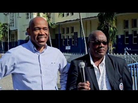 Jamaica College's board chairman Lance Hylton and acting principal Wayne Robinson at the school grounds on Thursday.