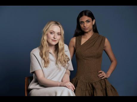 Credit: AP Dakota Fanning (left) and Ishana Night Shyamalan pose for a portrait to promote ‘The Watchers’.