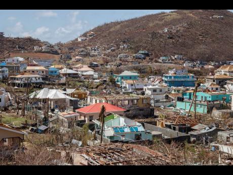 Credit: AP Homes destroyed by Hurricane Beryl lie in Clifton, Union Island, St. Vincent and the Grenadines.
