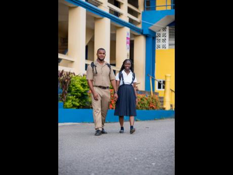 Matthew and Kimberley Silvera take a stroll on the grounds of Titchfield High School, located in Port Antonio, Portland.