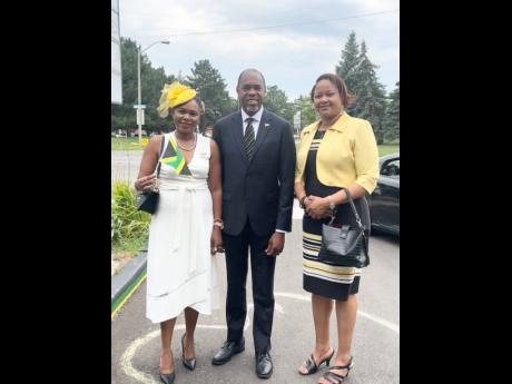 Consul General Kurt Davis (centre) with his wife, Dr Suzanne Robinson Davis (left) and Consul Younna Bailey Magalhães at the flag-raising ceremony outside the Jamaican Canadian Community Centre in Toronto.