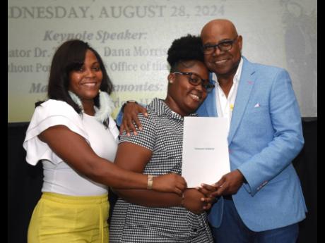 Dena Stewart (left), niece of Vinnette Stewart, joins in a photo with Tasharah Chambers, student of Montego Bay Community College, beneficiary of the East Central St James Scholarship Fund and recipient of the 2024 Vinnette Stewart Grant, who collected her