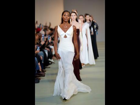 Credit: AP Naomi Campbell wears a creation as part of the Del Core Spring Summer 2025 collection that was presented in Milan, Italy on Wednesday.