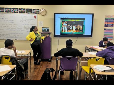 Richards teaching a class at the Academy Charter School in Hempstead, New York.