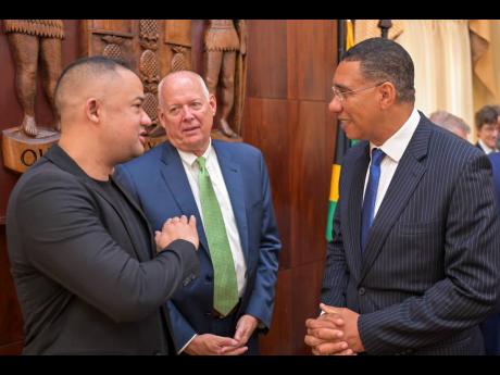 Prime Minister Andrew Holness (right), in discussion with Dr Paris Lyew-Ayee Jr (left), chairman of the International Centre for Environmental and Nuclear Sciences at The University of the West Indies, Mona, while Jack Craig, chief executive officer of Can