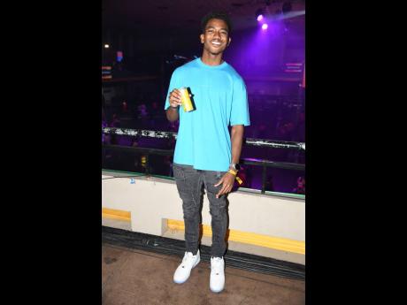 Social media influencer Chad Luchey went simple in a T-shirt, jeans and white Air Force Ones at the event.