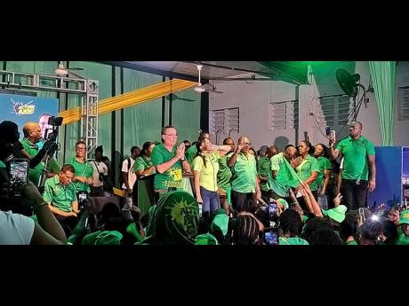East Portland MP Ann Marie Vaz with West Portland MP Daryl Vaz greet supporters  during a combined constituency meeting on Sunday.