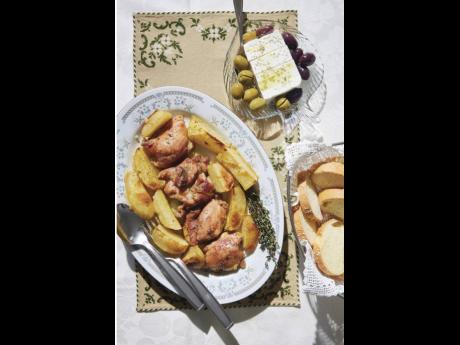 This image released by Harvest shows a recipe for Greek chicken from ‘The League of Kitchens Cookbook: Brilliant Tips, Secret Methods & Favorite Family Recipes from Around the World’ by Lisa Kyung Gross. 