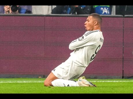 Real Madrid’s Kylian Mbappe celebrates after he scored his side’s first goal during the Champions League opening phase football match against Atalanta at the Bergamo’s stadium, in Bergamo, Italy, yesterday.