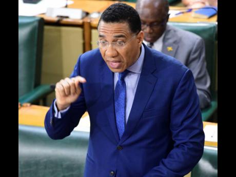          left: Prime Minister Dr Andrew Holness.
