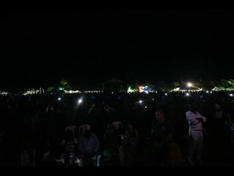 A short blackout leaves Plantation Cove in darkness as Richie Spice performs.