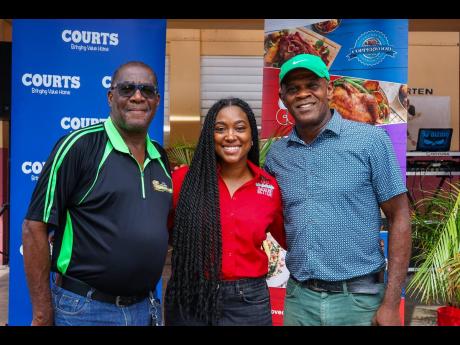 Credit: From left: Dwight Lawrence, brand manager, Courts Black River, joins Nicole Hall, commercial marketing manager, CB Foods, and Karl Whyte, councillor, South Western St Elizabeth, at the PAN Christmas Giveback Initiative.