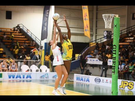 Jamaica’s Shimona Jok (right) battles with  Ane Retief of South Africa during the second ‘Test’ between the two teams at the National Indoor Sports Centre on Wednesday. 