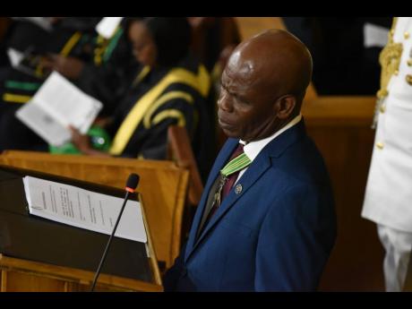 Credit: Ian Allen Custos of Kingston Steadman Fuller delivering the Throne Speech during the opening of Parliament on February 13