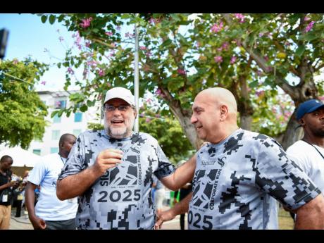 Credit: Matthew McKoy/Photographer Opposition Leader Mark Golding (left) and Christopher Zacca, president and CEO of Sagicor Group Jamaica and chairman of the Sagicor Foundation, at the Sagicor Sigma Run 2025.
