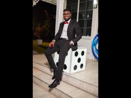 Credit: Contributed Jamaica Special Economic Zone Authority’s Jordan Ferguson looks dapper in his black suit and red bowtie.