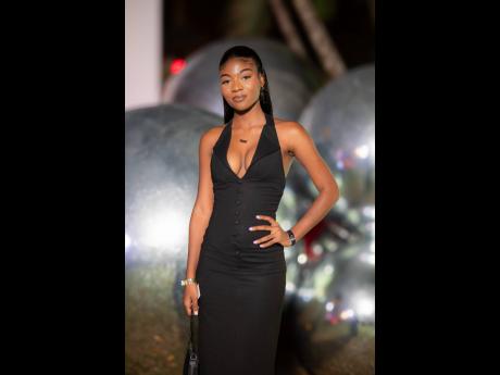 Credit: Contributed Tianna Chandler, Red Stripe communications intern, was effortlessly pulled together in a sleek black halter-neck dress with a tailored button-down bodice.