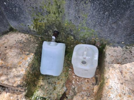 Credit: Rochelle Clayton Water jugs owned by Suzette Green.