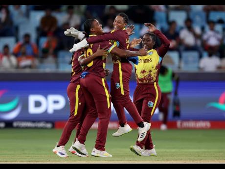 Credit: ICC photo Chinelle Henry (left) of West Indies Women celebrates with teammates after taking the wicket of Sarah Bryce of Scotland (not pictured) during an ICC Women’s T20 World Cup 2024 game at Dubai International Stadium on October 6.