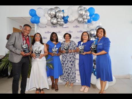 Seaboard Jamaica recognised its veterans of 25 years of service at a recent company event. From left: Michael Tyrell, Paula Arbouine, Kerry-Ann Williams, CEO Corah Ann Robertson-Sylvester, Zahra Masters, and Coreen Williams.