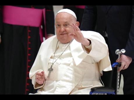 Credit: -AP Photo/Alessandra Tarantino, File Pope Francis waves as he arrives for his weekly general audience in the Paul VI Hall, at the Vatican on February 12, 2025.
