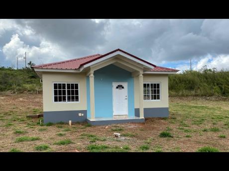 Credit: File This 2021 photo shows a model unit at NHT Perth Estate in Manchester.