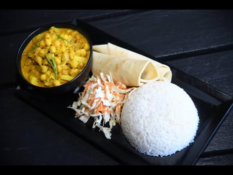 One of the popular options for vegans at Murray’s is the curried chickpeas, served with rice, roti and raw vegetables. 