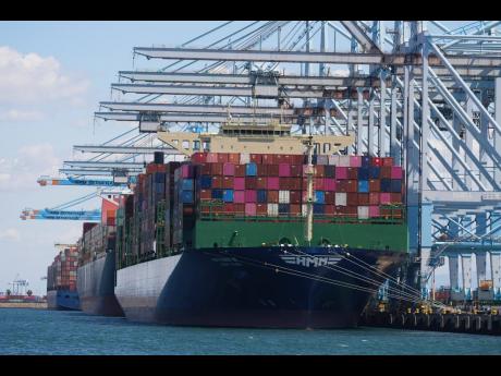 Credit: AP Ships are loaded at the Port of Los Angeles.