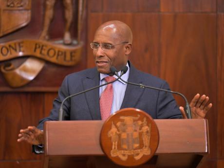 Credit: JIS News Minister of Industry, Investment and Commerce, Senator Aubyn Hill, speaking at a post-Cabinet press conference on Wednesday, April 9 at Jamaica House.